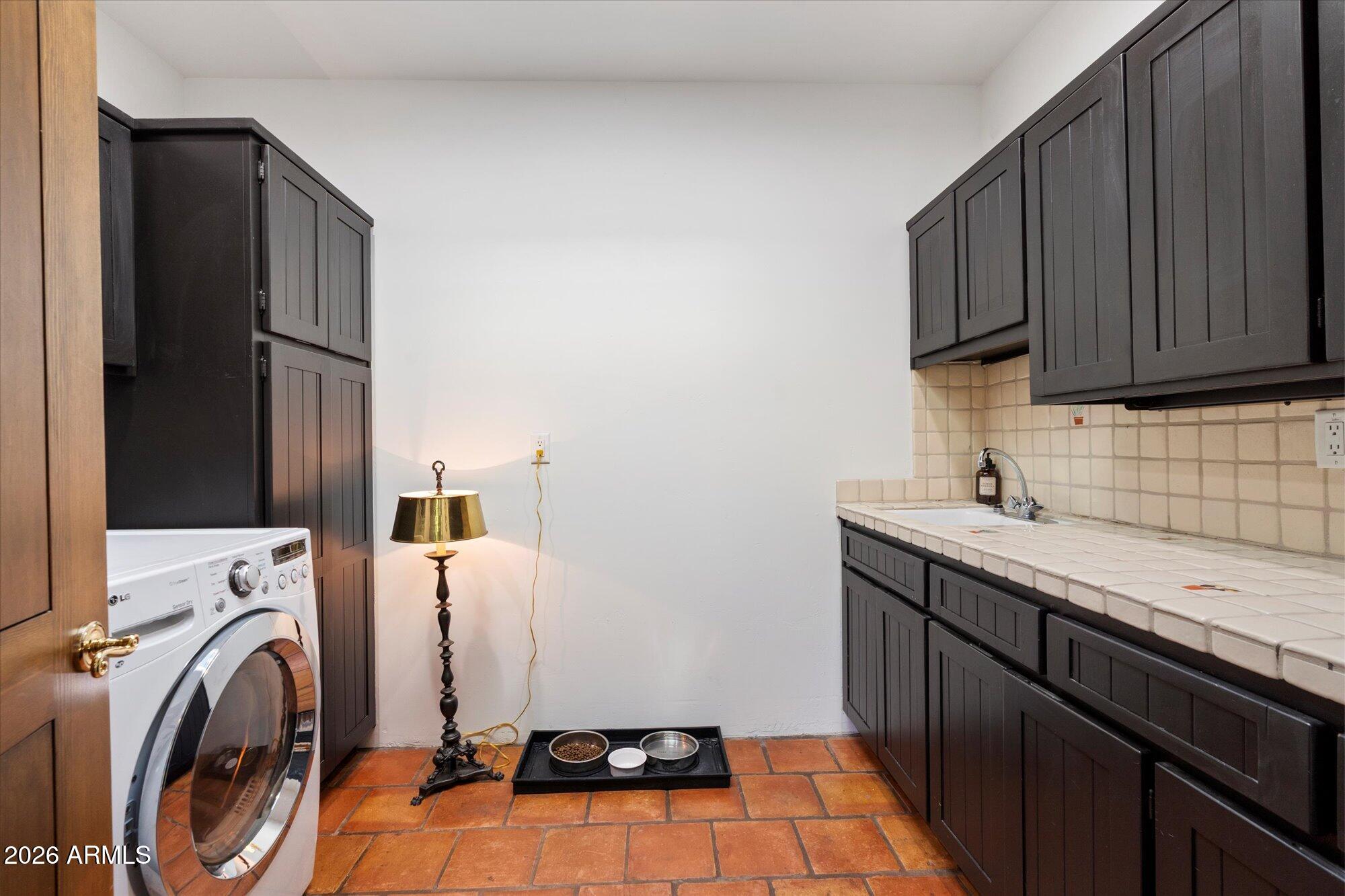 34815 North Arroyo Road Carefree, AZ 85377 - Photo 27 of 60 a utility room with sink dryer and washer