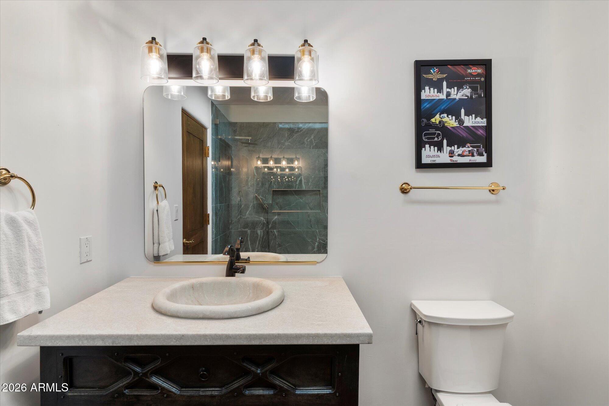34815 North Arroyo Road Carefree, AZ 85377 - Photo 29 of 60 a bathroom with a sink and a mirror