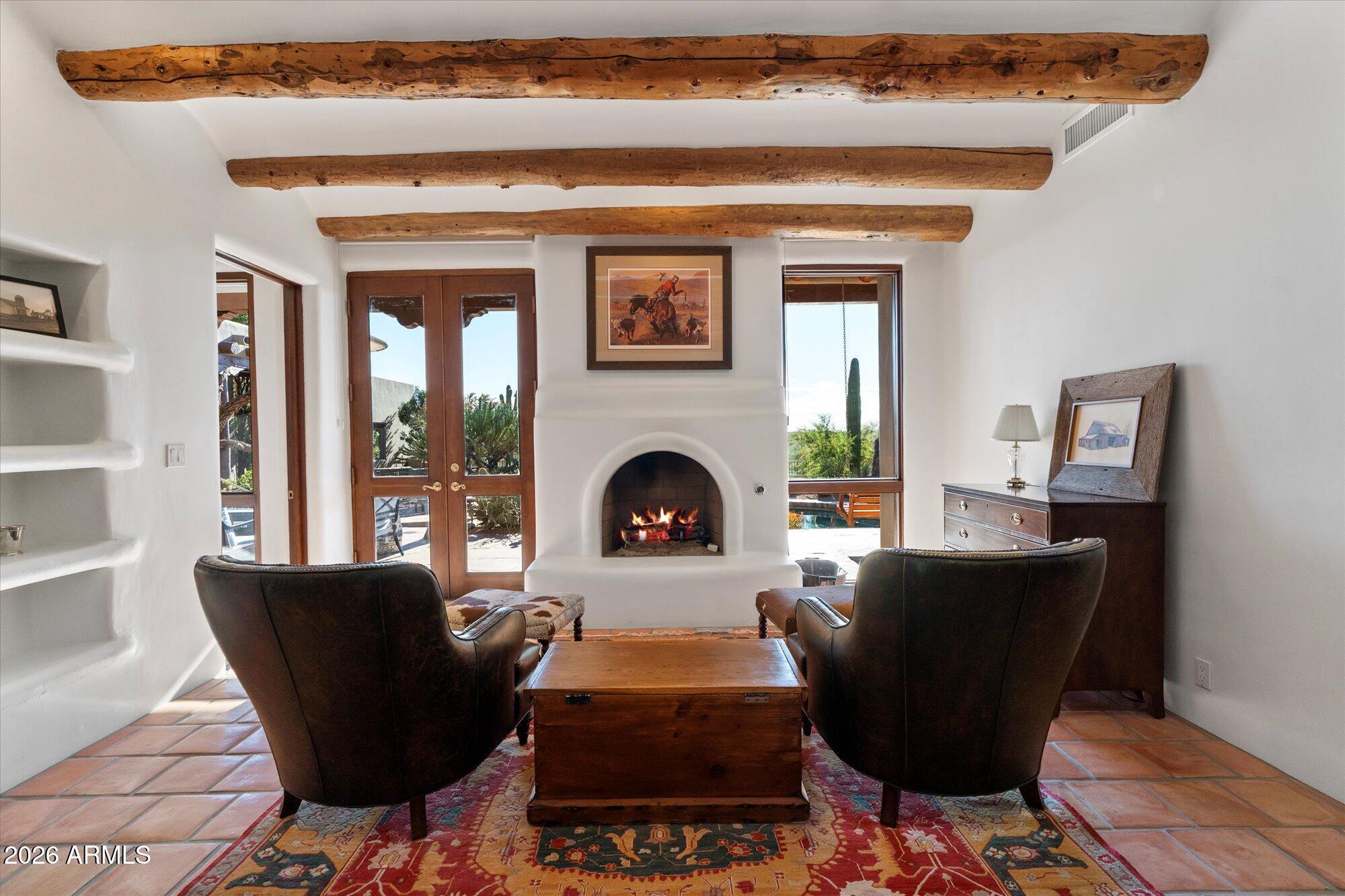 34815 North Arroyo Road Carefree, AZ 85377 - Photo 33 of 60 a living room with furniture and a fireplace
