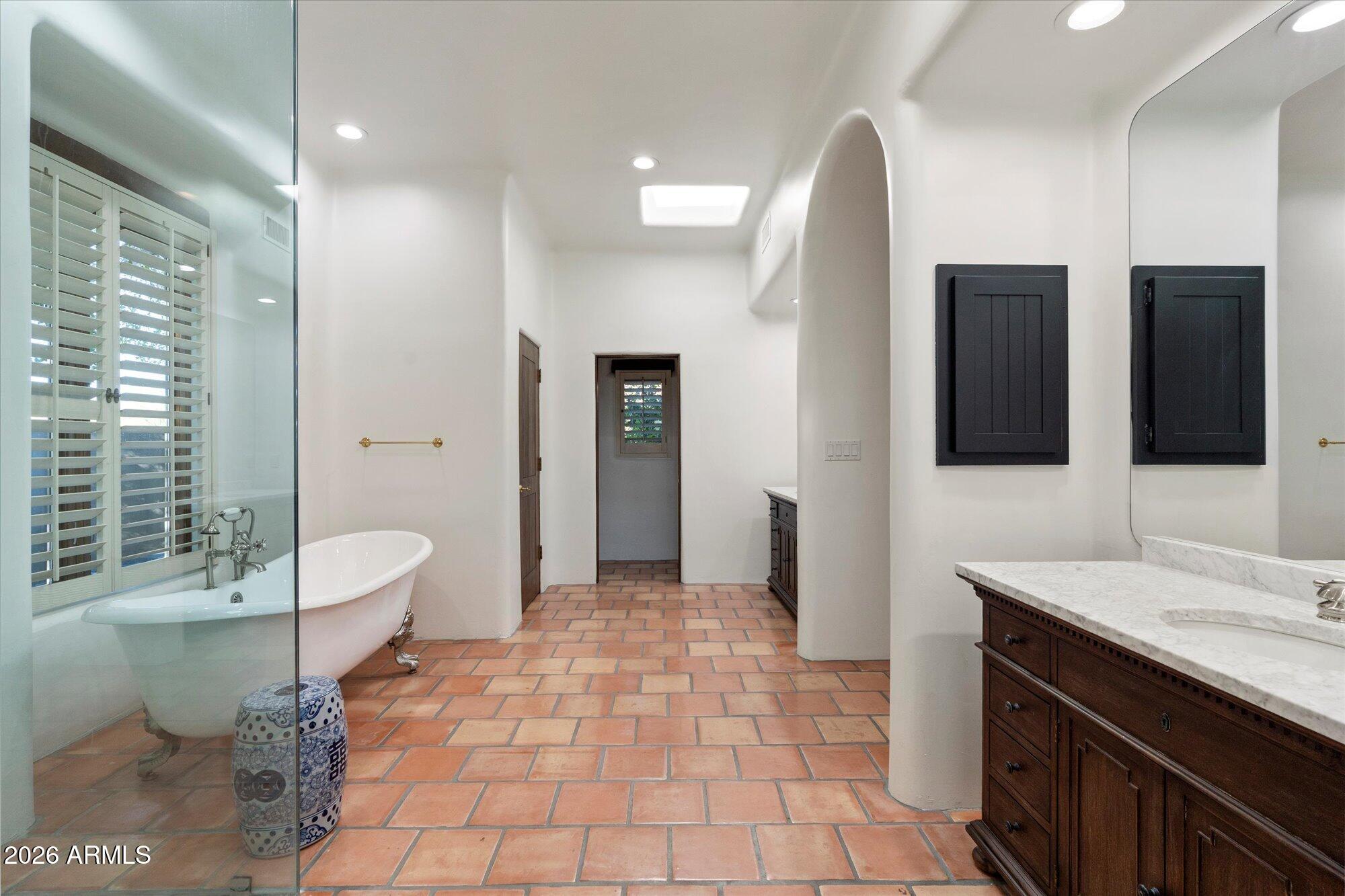 34815 North Arroyo Road Carefree, AZ 85377 - Photo 36 of 60 a spacious bathroom with a double vanity sink toilet and shower