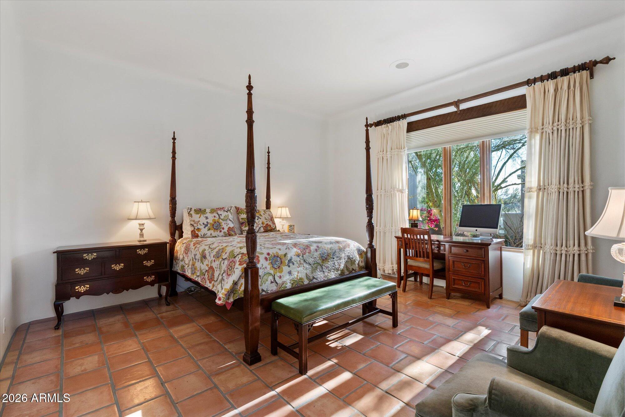 34815 North Arroyo Road Carefree, AZ 85377 - Photo 39 of 60 a bed room with furniture and a window