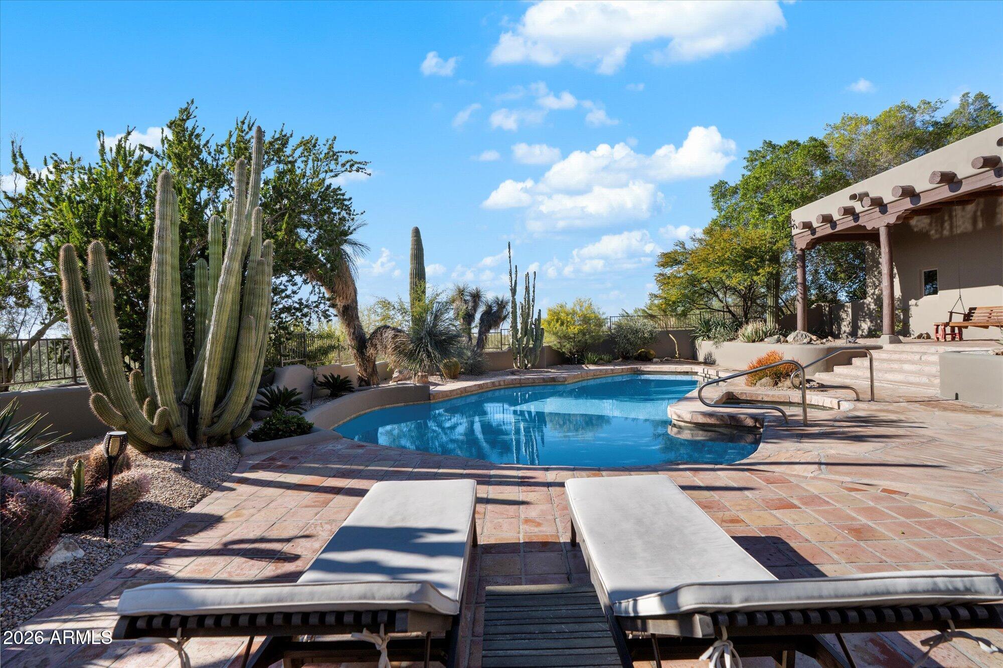 34815 North Arroyo Road Carefree, AZ 85377 - Photo 46 of 60 a view of a backyard with plants and outdoor seating
