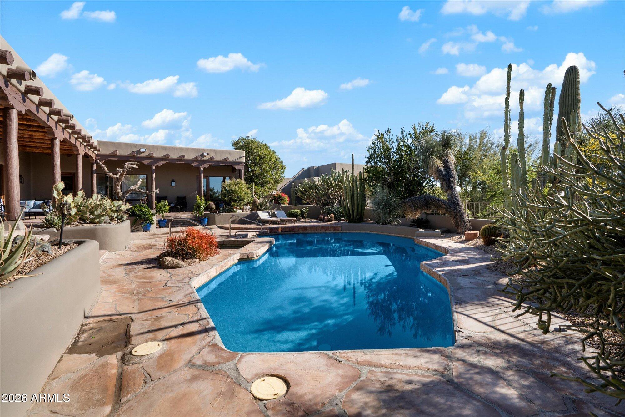 34815 North Arroyo Road Carefree, AZ 85377 - Photo 49 of 60 a view of swimming pool with outdoor seating