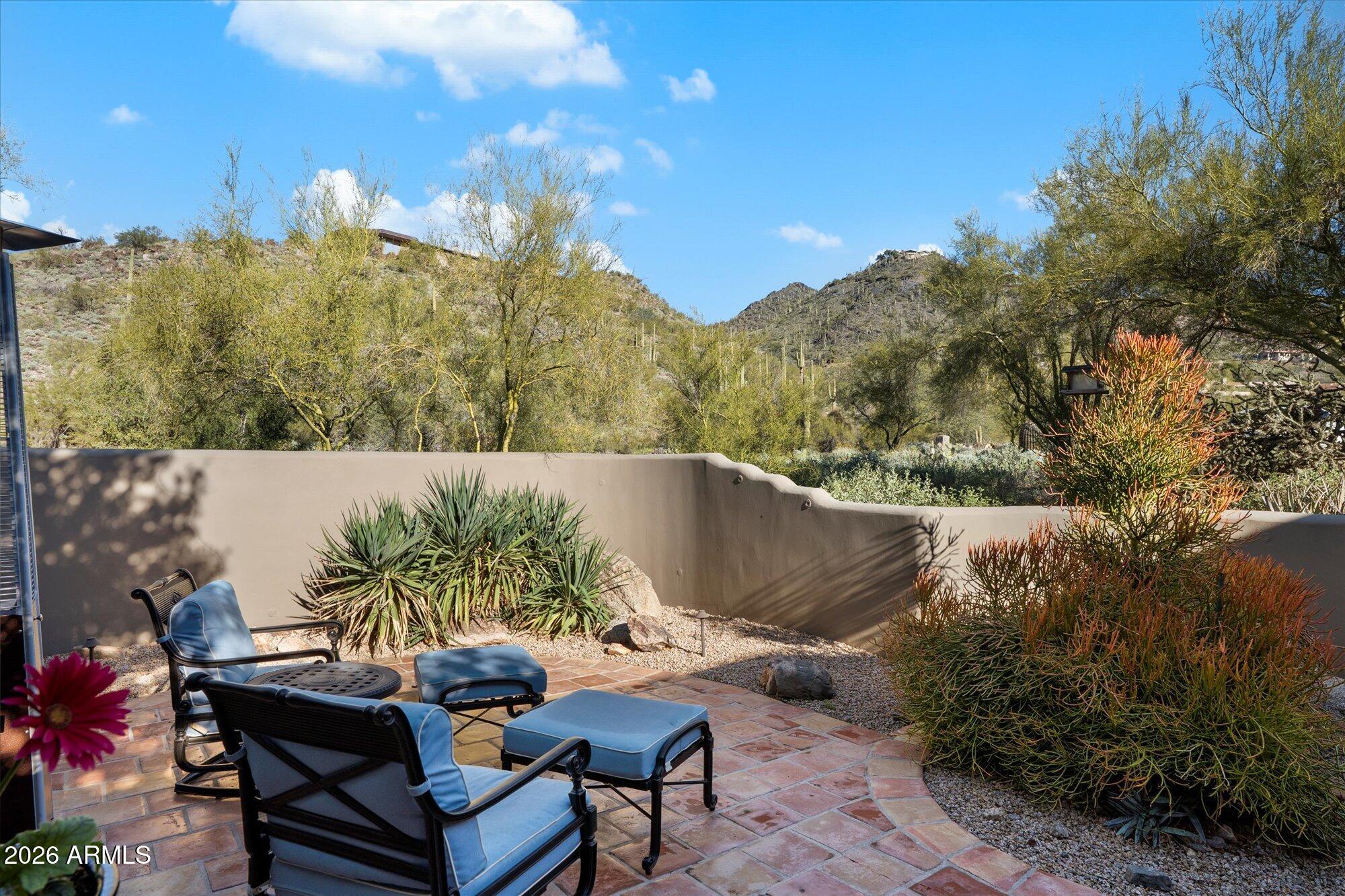 34815 North Arroyo Road Carefree, AZ 85377 - Photo 51 of 60 a backyard of a house with table and chairs