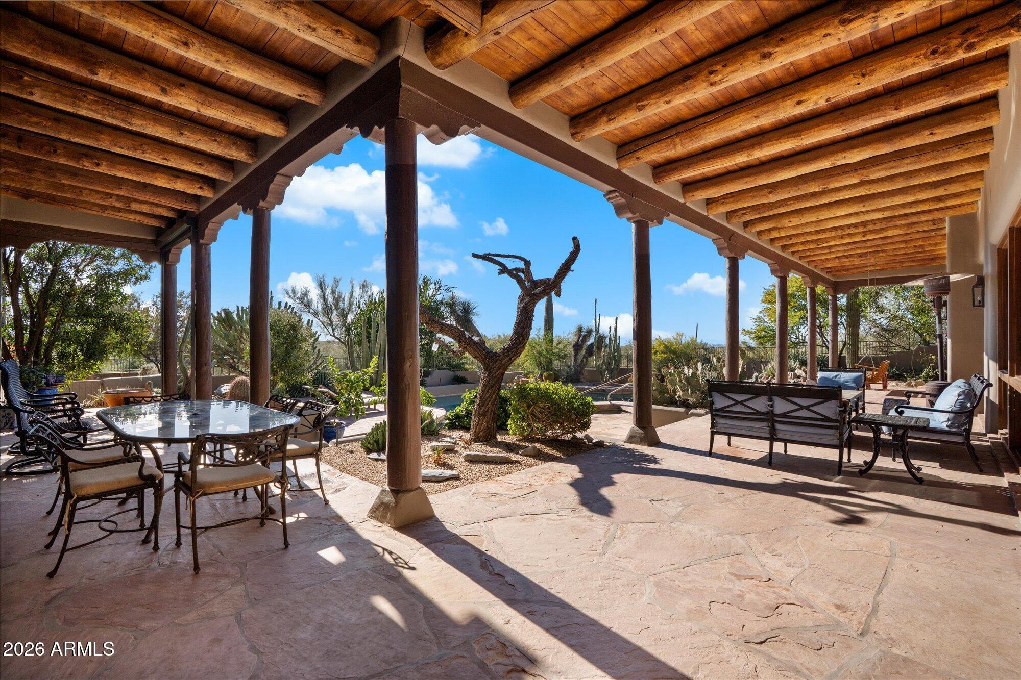 34815 North Arroyo Road Carefree, AZ 85377 - Photo 52 of 60 a building outdoor space with patio lots of furniture and garden view