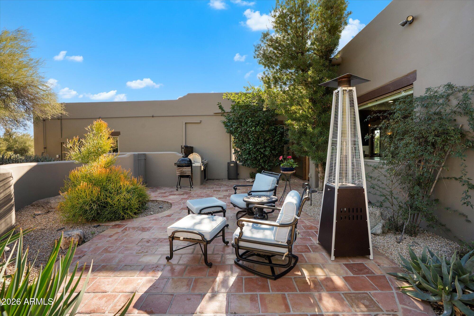 34815 North Arroyo Road Carefree, AZ 85377 - Photo 53 of 60 a view of a patio with table and chairs and potted plants