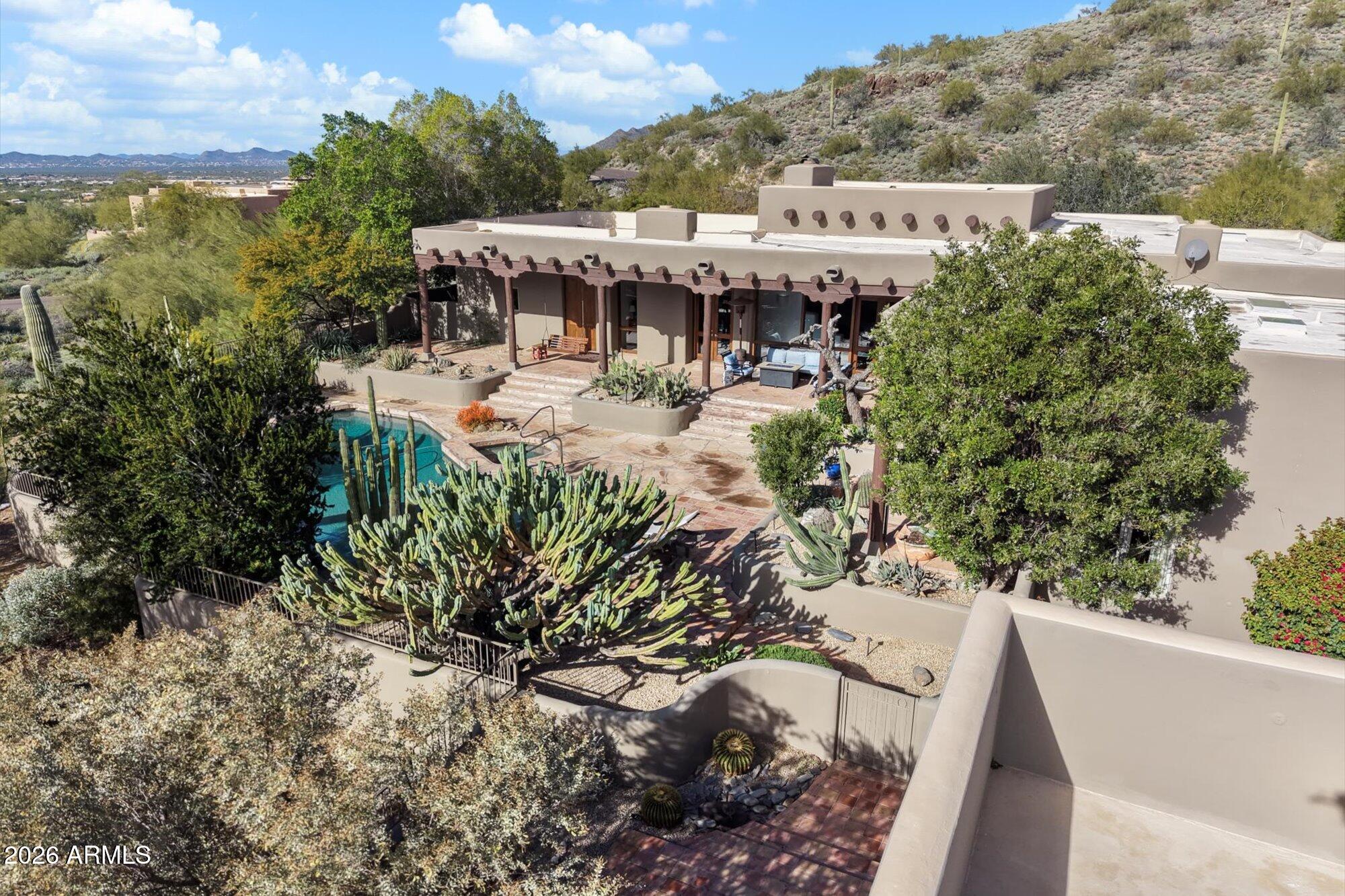 34815 North Arroyo Road Carefree, AZ 85377 - Photo 56 of 60 a view of a swimming pool with a patio