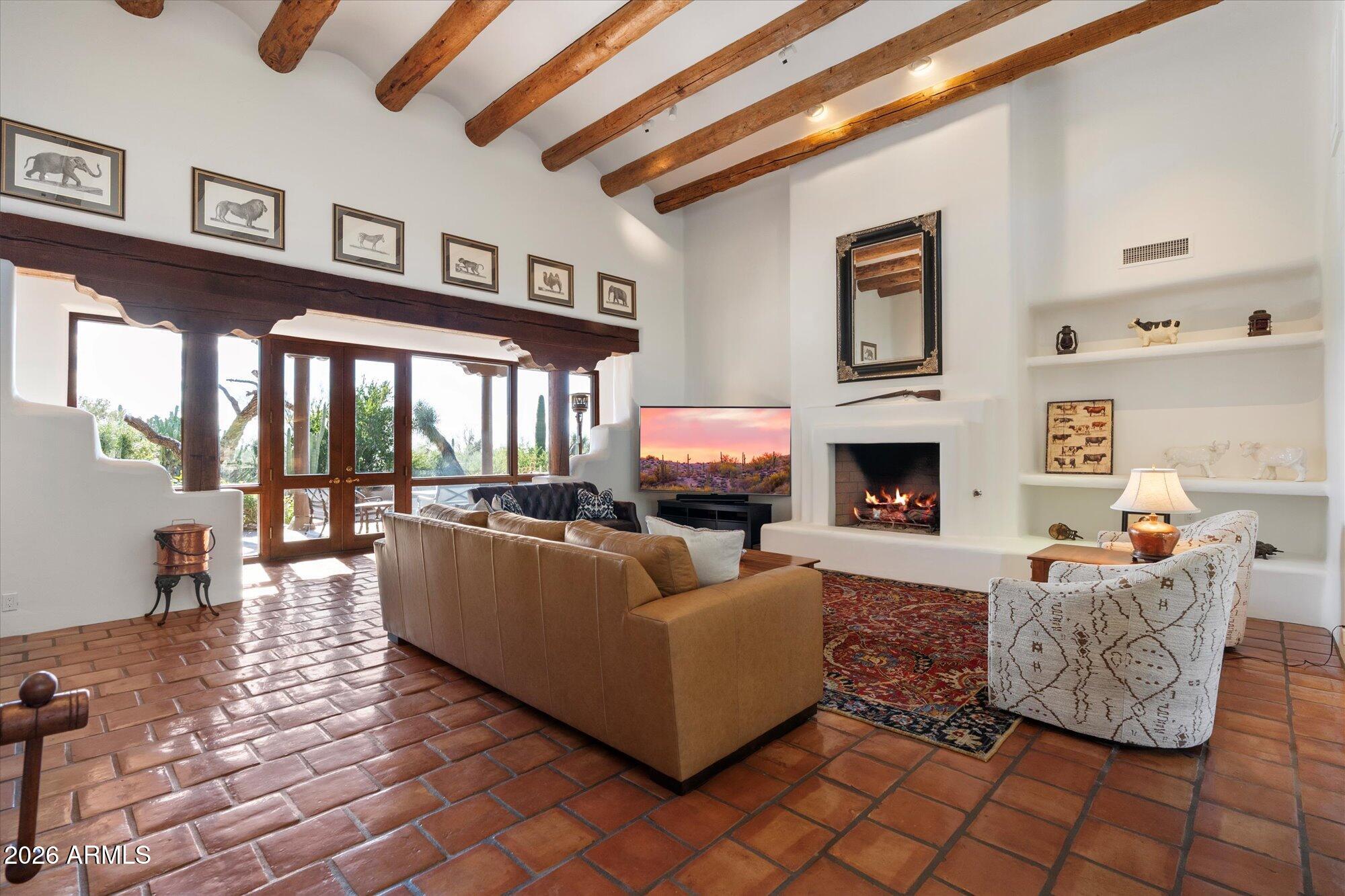 34815 North Arroyo Road Carefree, AZ 85377 - Photo 8 of 60 a living room with furniture and a fireplace