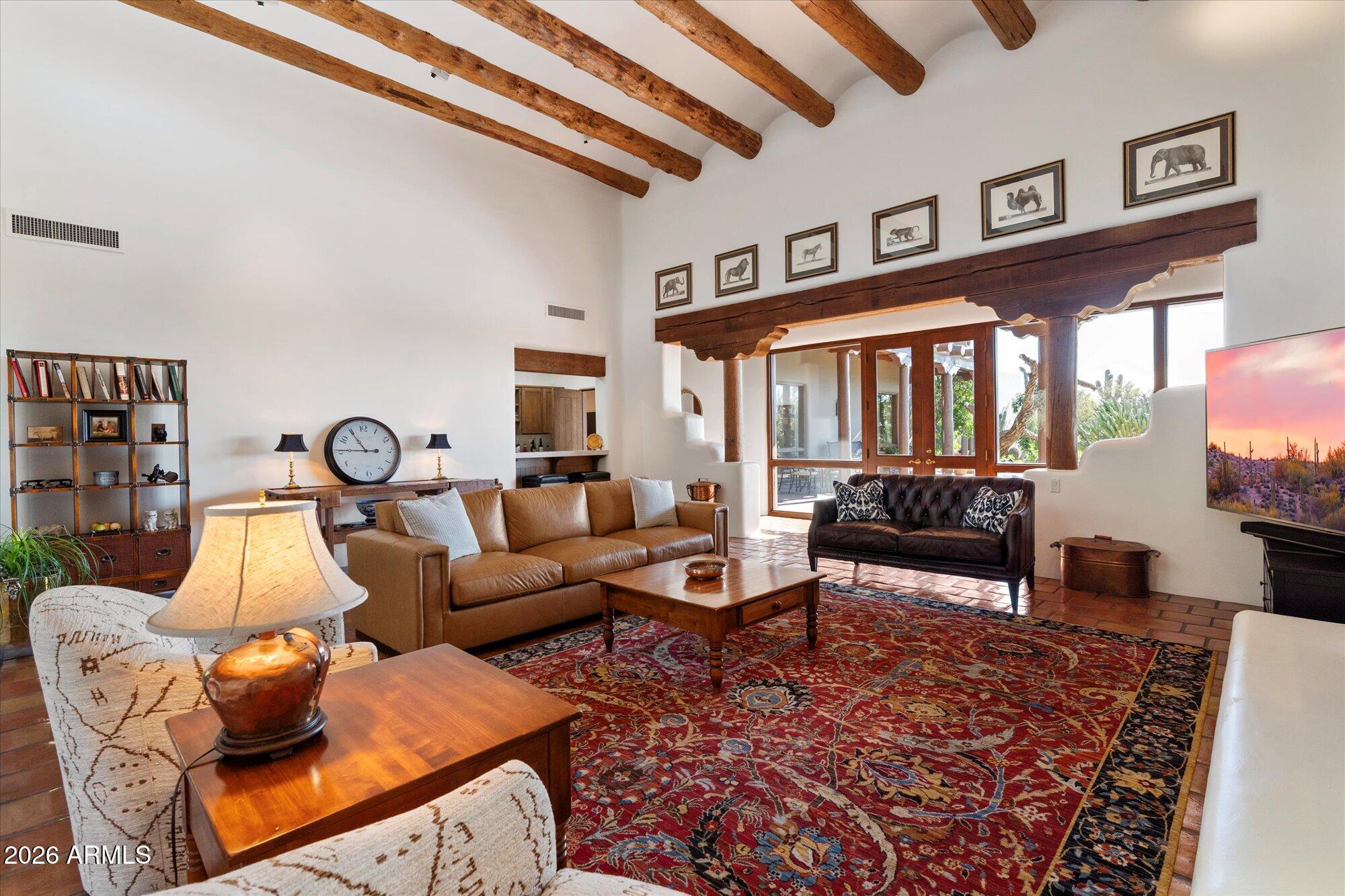 34815 North Arroyo Road Carefree, AZ 85377 - Photo 9 of 60 a living room with furniture a rug and a large window