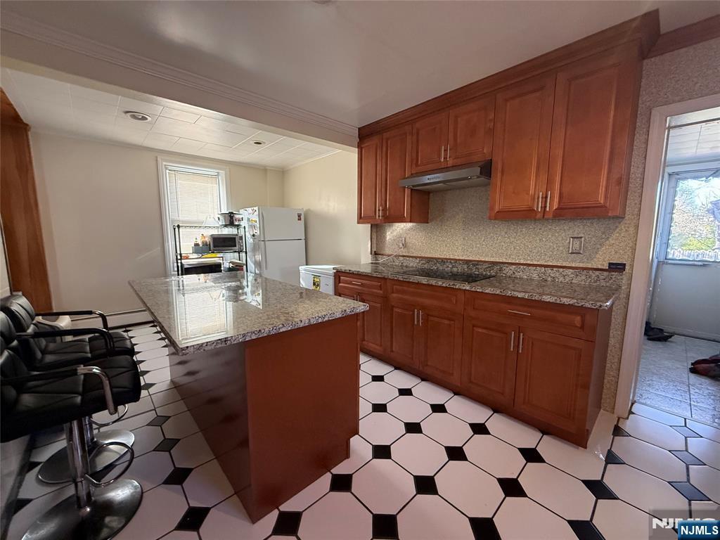 88 Main Street Little Ferry, NJ 07643 - Photo 12 of 32 a kitchen with stainless steel appliances granite countertop a sink stove and cabinets