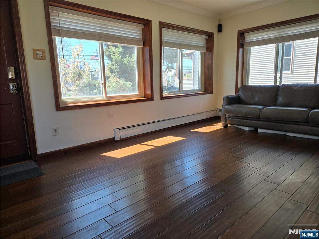 88 Main Street Little Ferry, NJ 07643 - Photo 5 of 32 a living room with wooden floors and a window