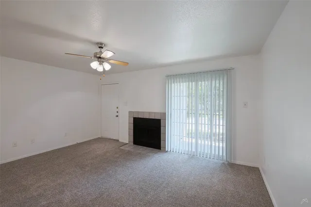 wooden floor in a room with a fireplace