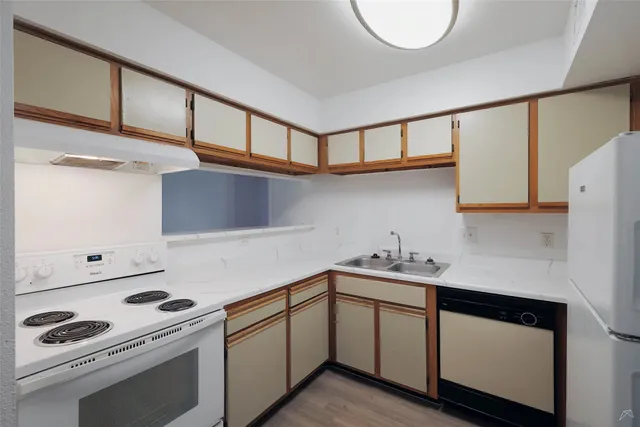 a kitchen with a stove and a microwave