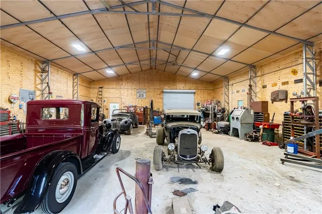 a view of a car park in front of a house