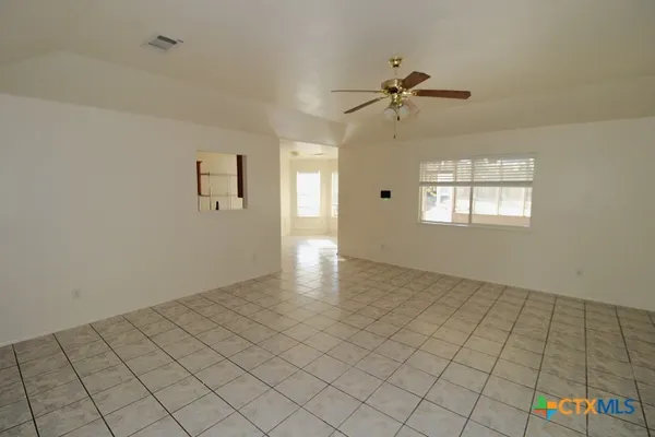 a view of an empty room and window