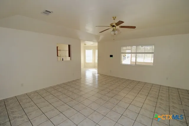 a view of an empty room and window
