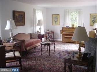 1222 Upper Gulph Road Wayne, PA 19087 - Photo 2 of 6 a living room with furniture a dining table and a window