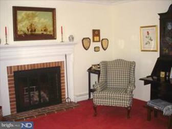 1222 Upper Gulph Road Wayne, PA 19087 - Photo 5 of 6 a living room with furniture and a fireplace