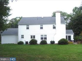 1222 Upper Gulph Road Wayne, PA 19087 - Photo 6 of 6 a front view of a house with a garden