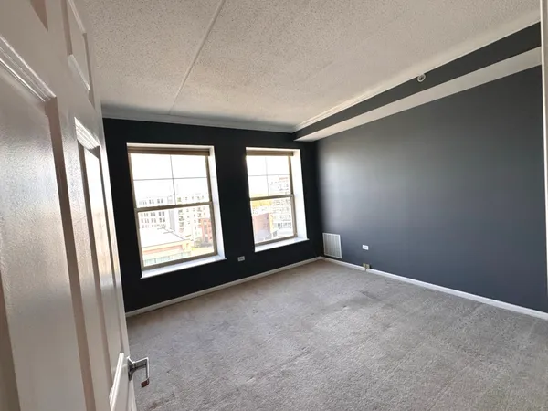 an empty room with windows
