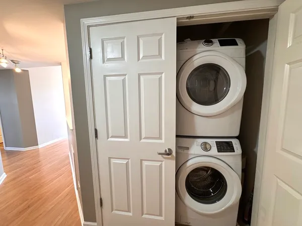 a view of a hallway with washer and dryer