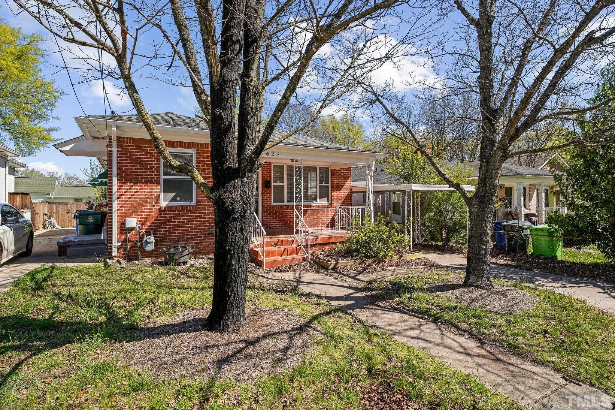 625 Coleman Street Raleigh, NC 27610 - Photo 2 of 22 a view of a house with backyard and trees