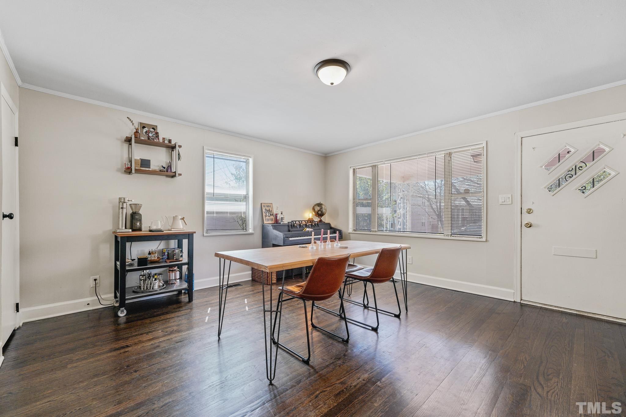 625 Coleman Street Raleigh, NC 27610 - Photo 5 of 22 a view of a dining room with furniture window and wooden floor