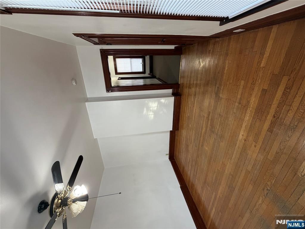 64 Knickerbocker Road, Unit 2 2 Englewood, NJ 07631 - Photo 13 of 27 wooden floor in an empty room with a window