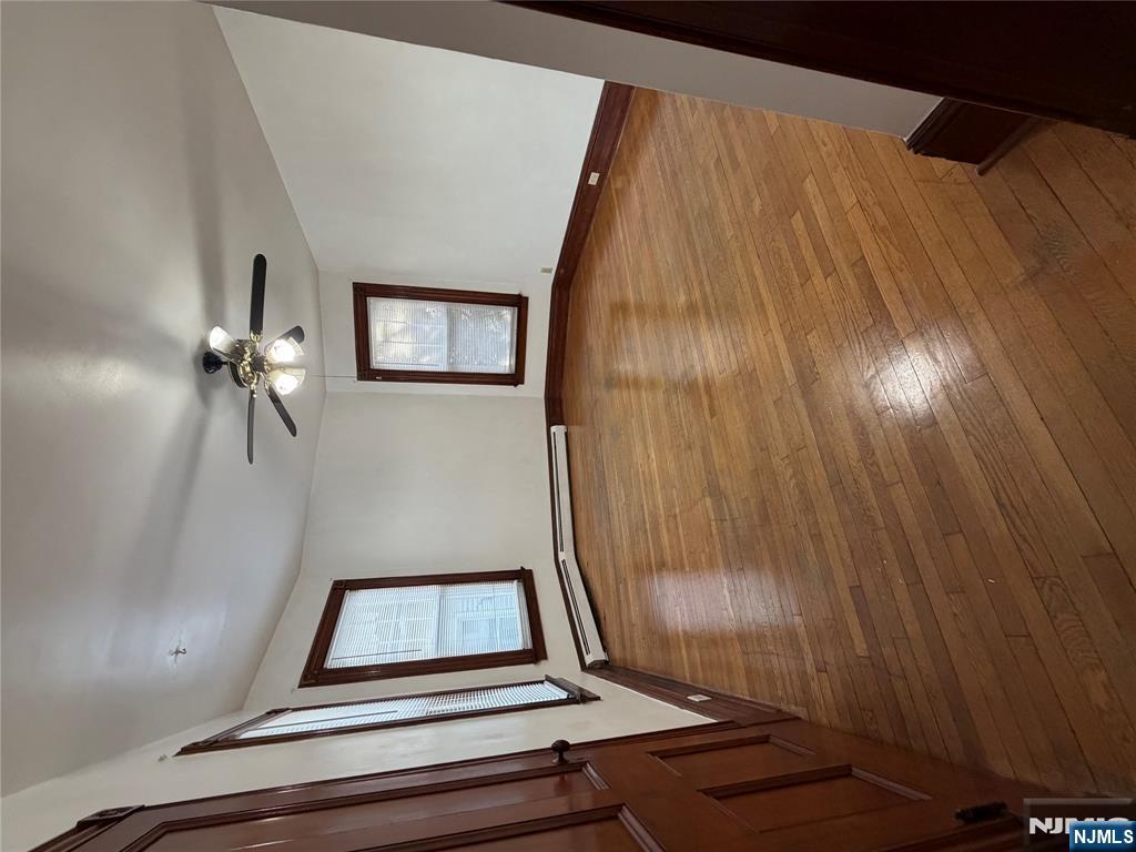 64 Knickerbocker Road, Unit 2 2 Englewood, NJ 07631 - Photo 16 of 27 a view of an empty room with wooden floor and window
