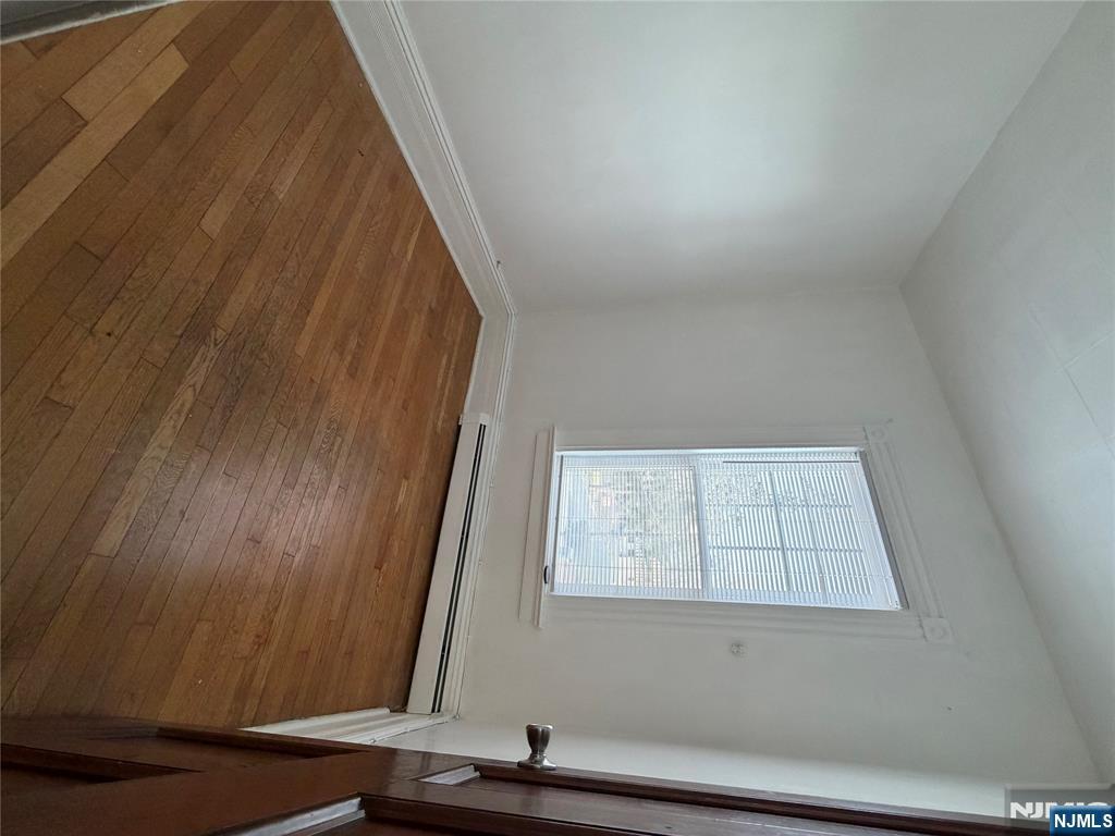 64 Knickerbocker Road, Unit 2 2 Englewood, NJ 07631 - Photo 20 of 27 an empty room with wooden floor and windows