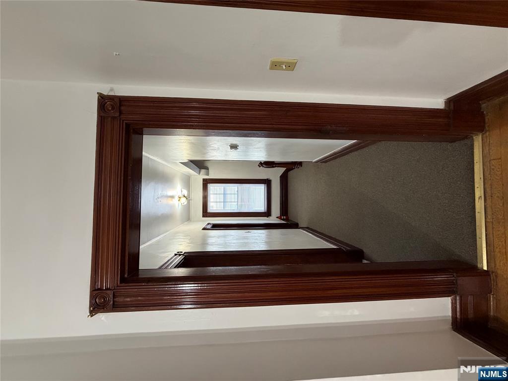 64 Knickerbocker Road, Unit 2 2 Englewood, NJ 07631 - Photo 22 of 27 a view of a hallway with wooden floor