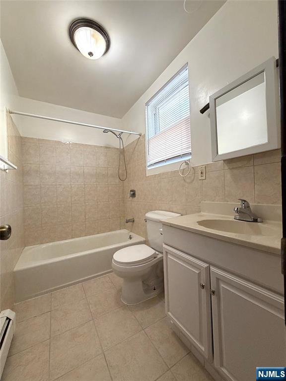 64 Knickerbocker Road, Unit 2 2 Englewood, NJ 07631 - Photo 25 of 27 a bathroom with a toilet a sink a mirror a bathtub and shower