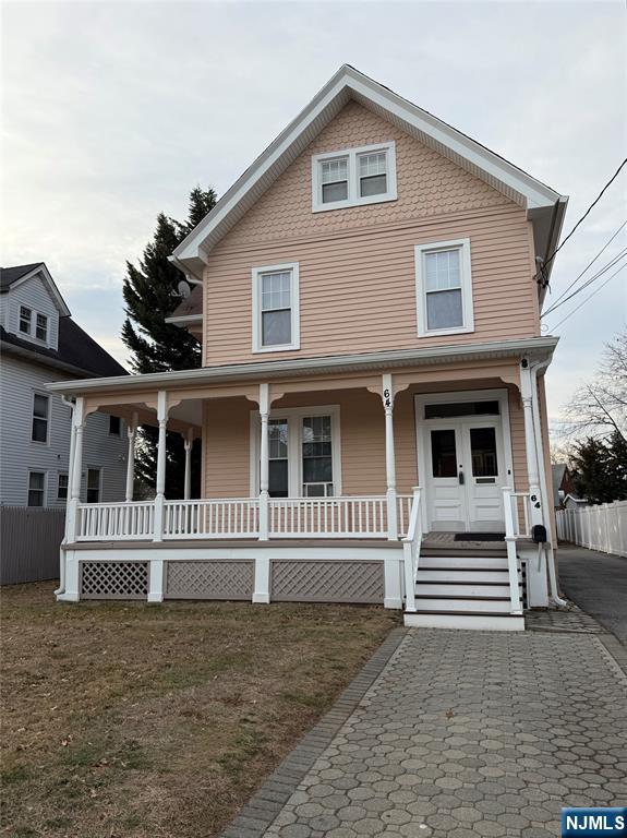 64 Knickerbocker Road, Unit 2 2 Englewood, NJ 07631 - Photo 26 of 27 a front view of a house with a fence