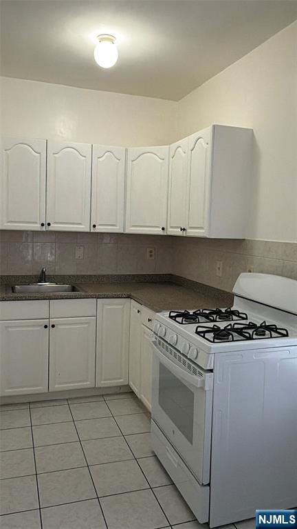 64 Knickerbocker Road, Unit 2 2 Englewood, NJ 07631 - Photo 6 of 27 a kitchen with granite countertop white cabinets and stainless steel appliances