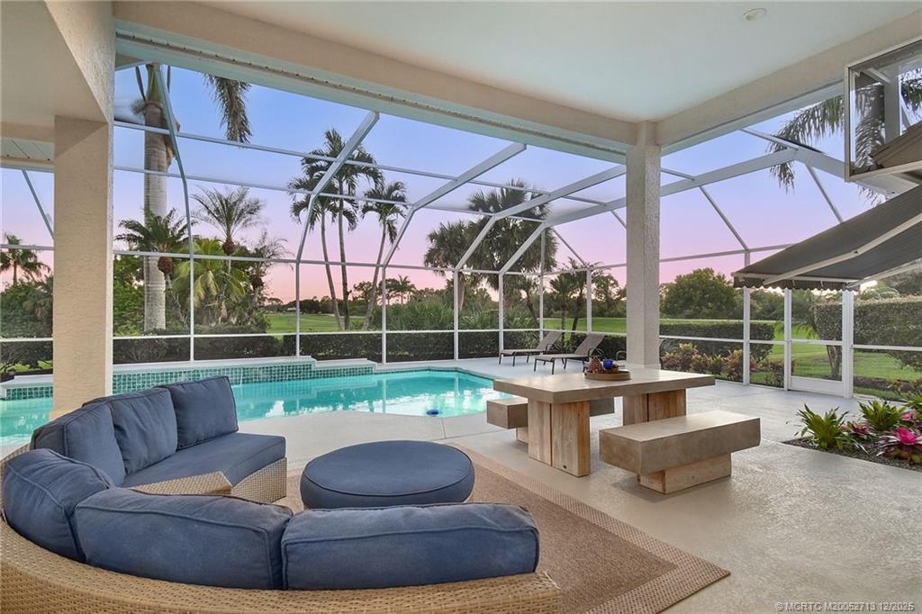 a view of a patio with couches and a fire pit