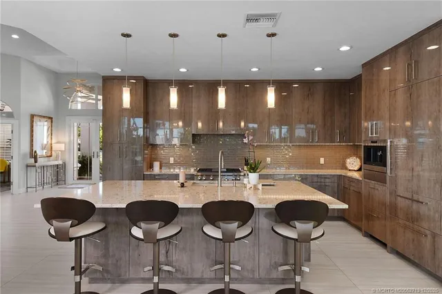 a large kitchen with lots of counter space a sink and appliances