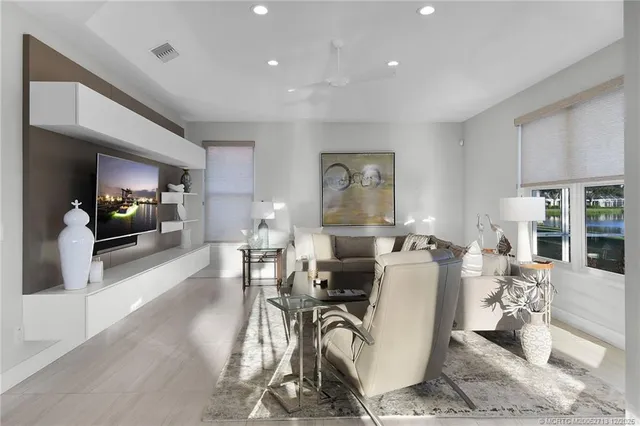 a spacious bedroom with a bed and large windows