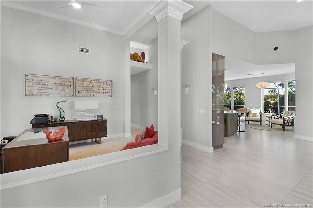 8149 Southeast Double Tree Drive Hobe Sound, FL 33455 - Photo 21 of 61 a living room with furniture and a table