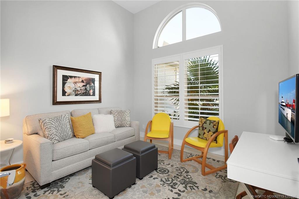 8149 Southeast Double Tree Drive Hobe Sound, FL 33455 - Photo 23 of 61 a living room with furniture and a flat screen tv