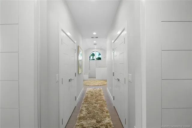 a en suite bathroom with a granite countertop sink and a mirror
