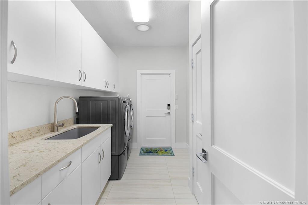 8149 Southeast Double Tree Drive Hobe Sound, FL 33455 - Photo 36 of 61 a bathroom with a sink a toilet and shower