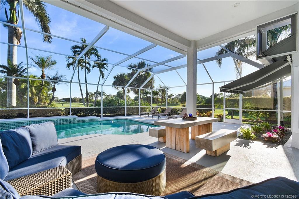 8149 Southeast Double Tree Drive Hobe Sound, FL 33455 - Photo 37 of 61 a view of a patio with couches and chairs
