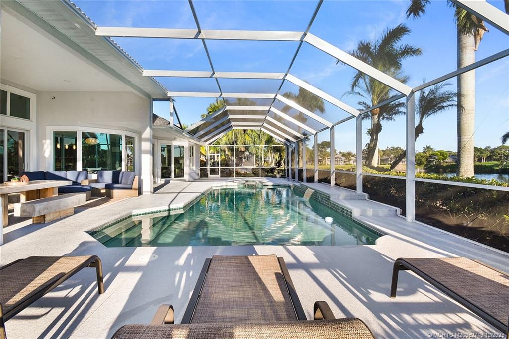 8149 Southeast Double Tree Drive Hobe Sound, FL 33455 - Photo 41 of 61 a view of a swimming pool with sitting area