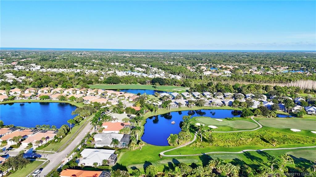 8149 Southeast Double Tree Drive Hobe Sound, FL 33455 - Photo 52 of 61 an aerial view of residential houses with outdoor space and trees