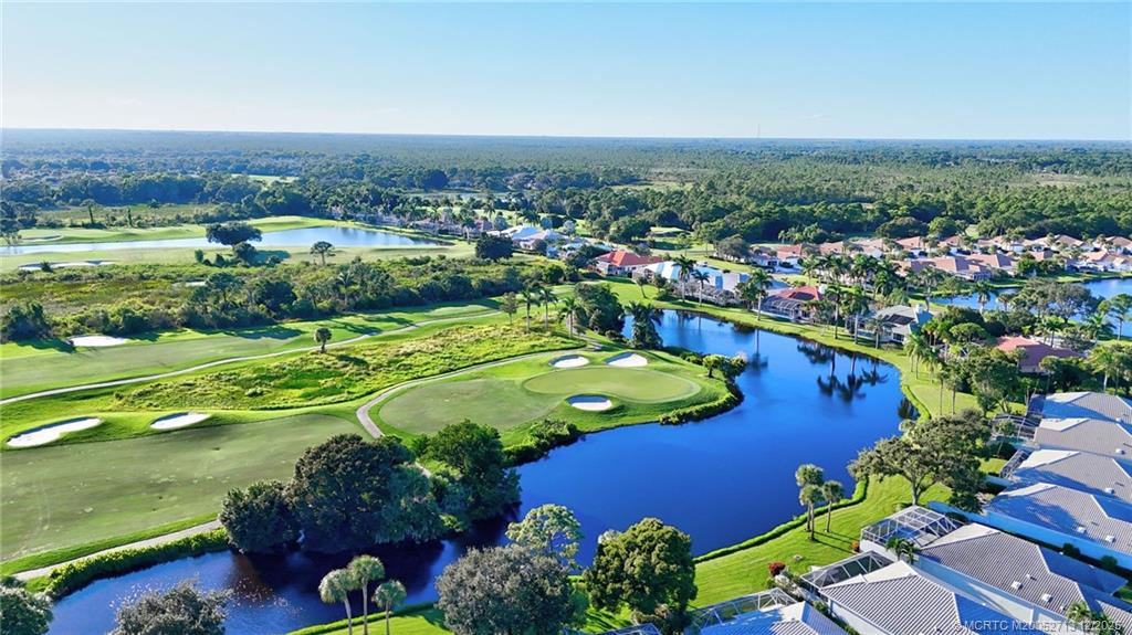 8149 Southeast Double Tree Drive Hobe Sound, FL 33455 - Photo 54 of 61 an aerial view of a pool yard and outdoor seating