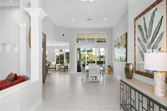 a large kitchen with cabinets a sink a counter space and stainless steel appliances