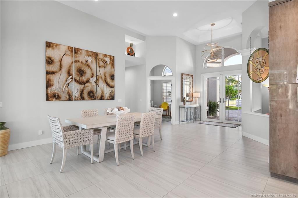 8149 Southeast Double Tree Drive Hobe Sound, FL 33455 - Photo 8 of 61 a dining room with furniture and window