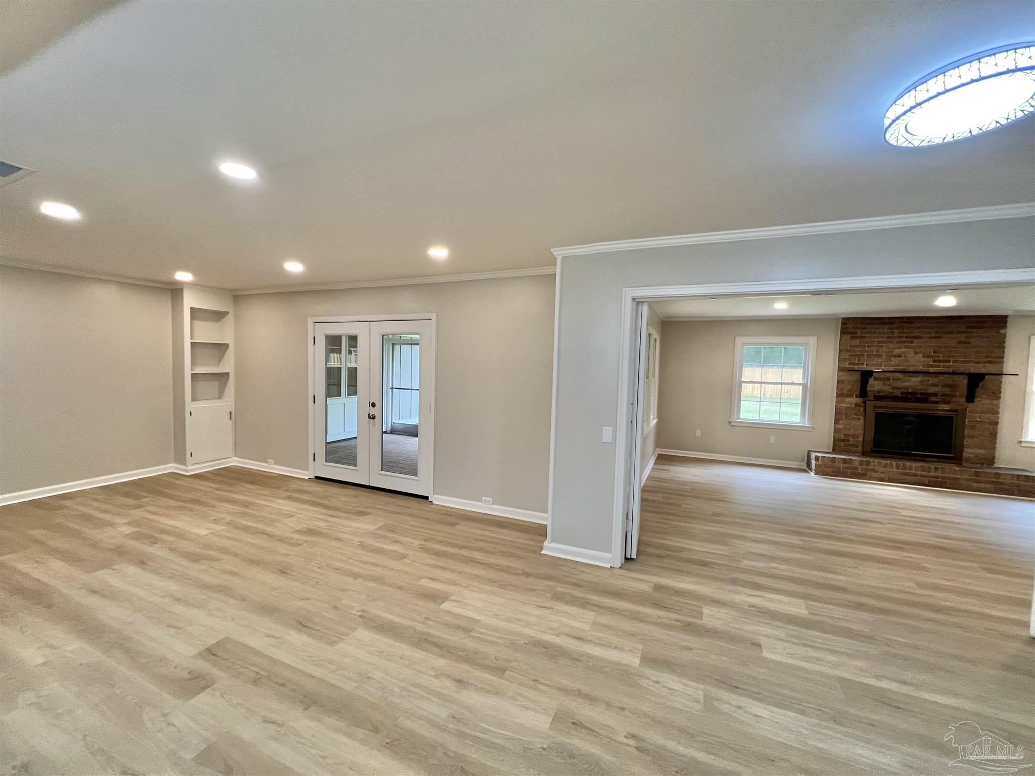 618 South Carney Street Atmore, AL 36502 - Photo 17 of 39 a view of an empty room with window and fire place