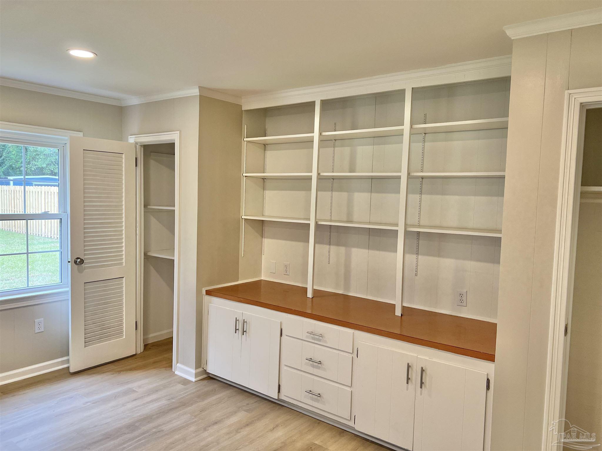 618 South Carney Street Atmore, AL 36502 - Photo 5 of 39 a room with cabinet and view of hallway