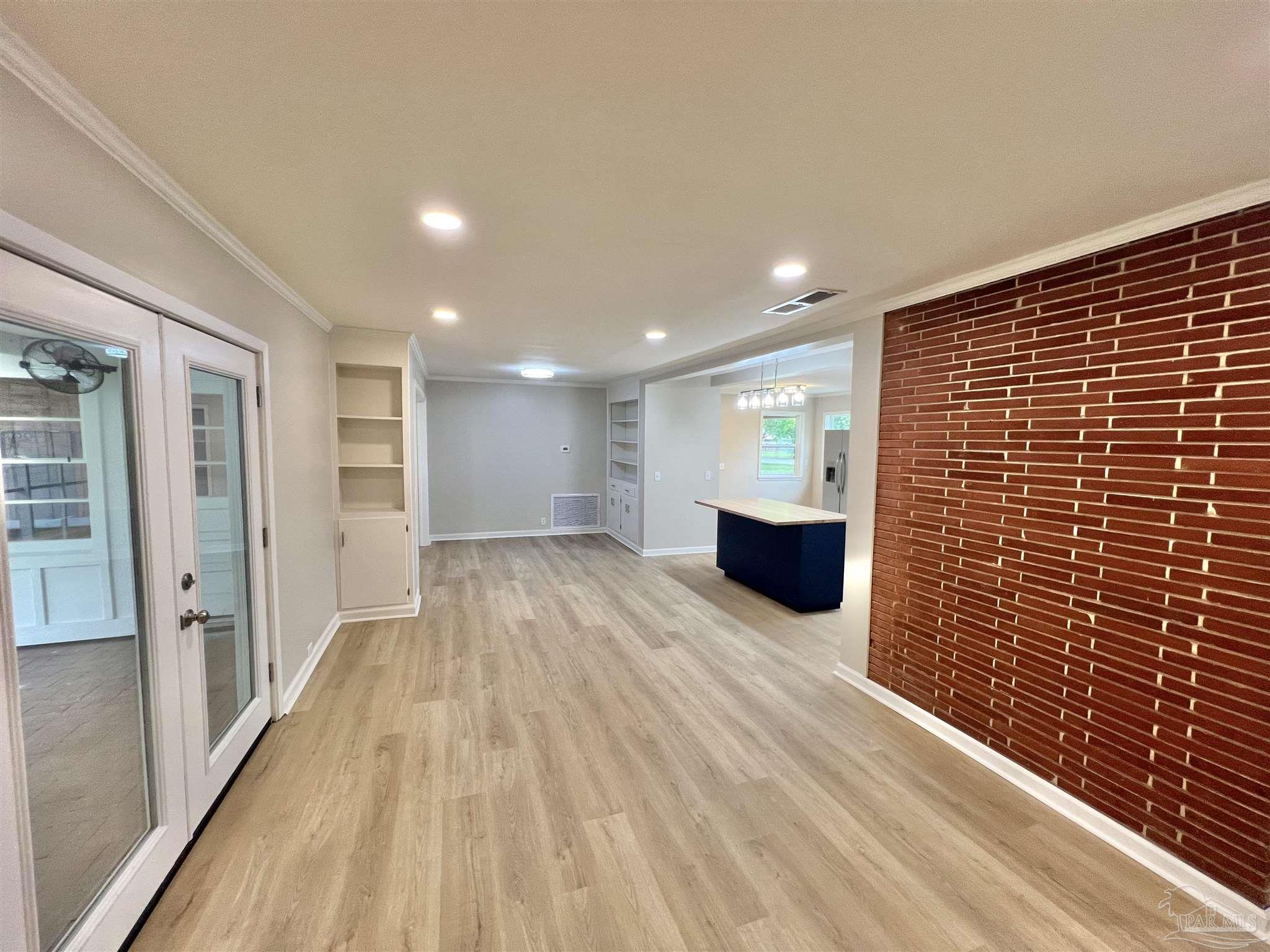 618 South Carney Street Atmore, AL 36502 - Photo 8 of 39 a view of a livingroom with wooden floor and a hallway